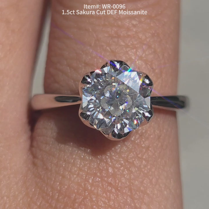 DovEggs 1.5ct Sakura cut moissanite solitaire engagement ring sparkling in sunlight video.