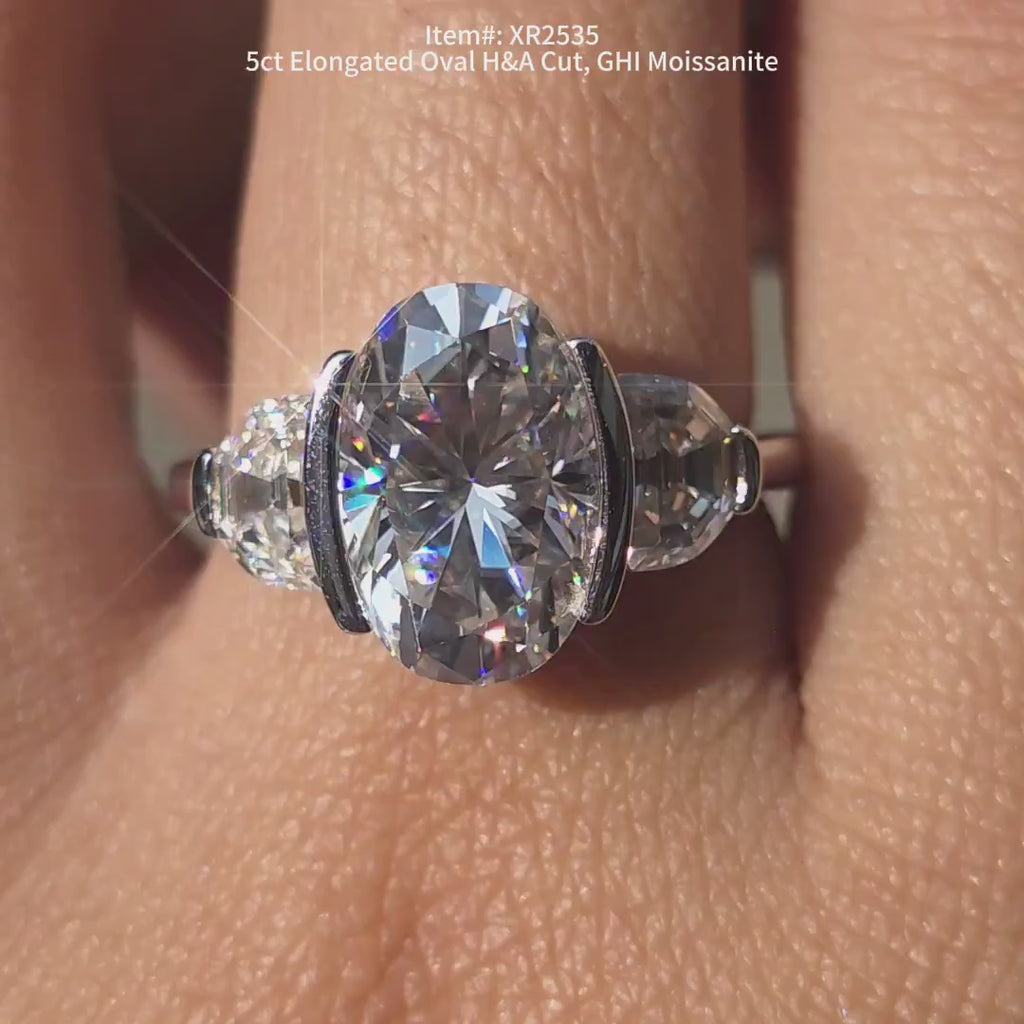 DovEggs oval three stones moissanite engagement ring in sunlighting