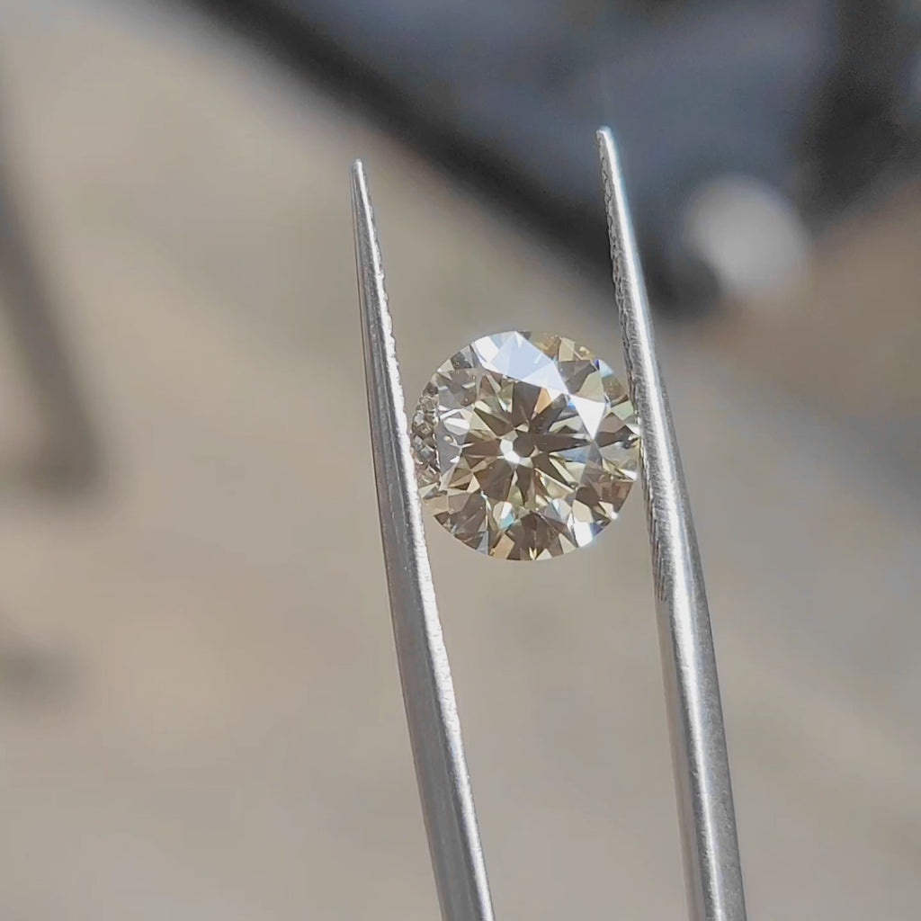 "Sunlight video showing 3.23ct old Euro cut round lab diamond's chunky facets and yellow fire"