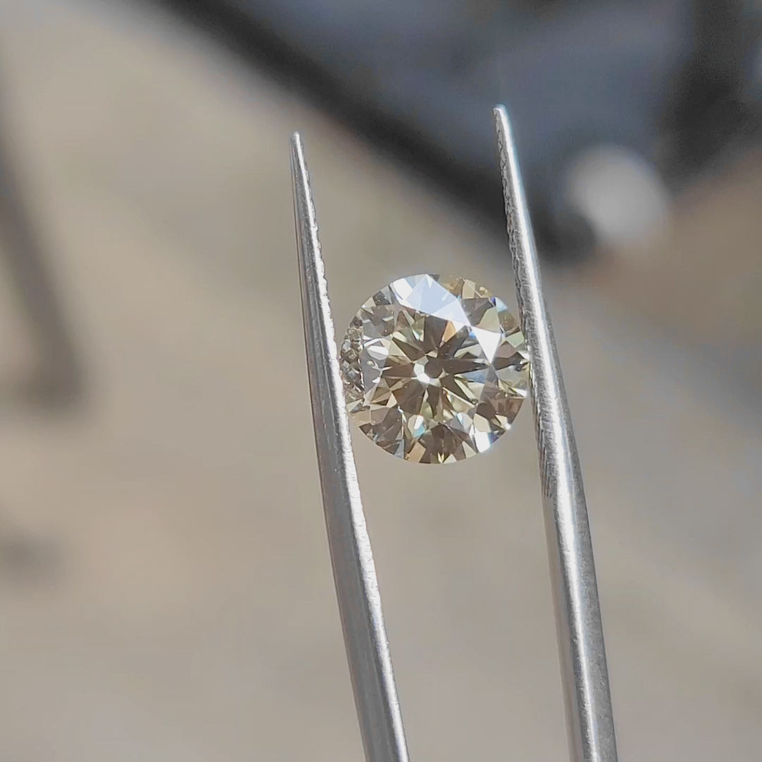 "Sunlight video showing 3.23ct old Euro cut round lab diamond's chunky facets and yellow fire"