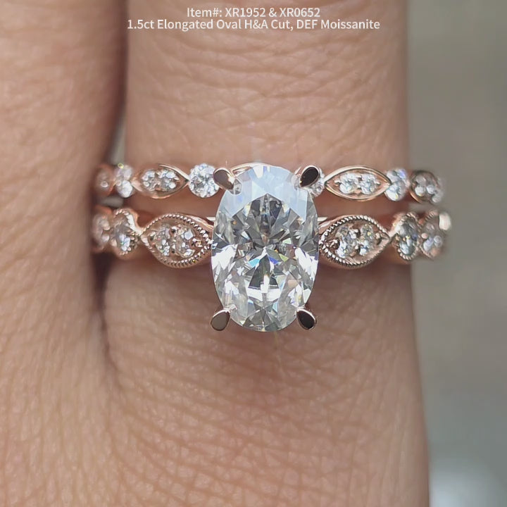 DovEggs 1.5ct Elongated Oval Hearts & Arrows cut DEF color moissanite ring sparkling in natural lighting video.