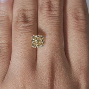 Close-up of 2.30ct diamond's facet pattern under warm light