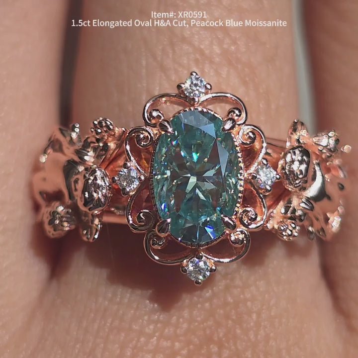 DovEggs Elongated oval Peacock blue  moissanite ring | vintage engagement ring sparkling in sunlight video.