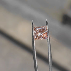 Sunlight video highlighting 2.77ct princess cut's vivid pink saturation