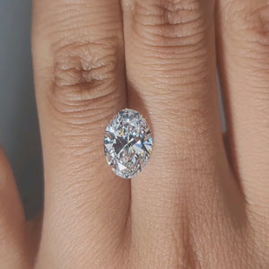 Hand-worn video showing 2.61ct oval diamond in warm home lighting