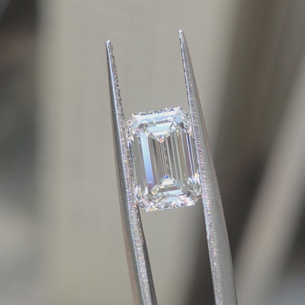 Lab diamond 2.58ct emerald cut F color VVS2 by DovEggs displaying elegant step-cut brilliance in outdoor sunlight