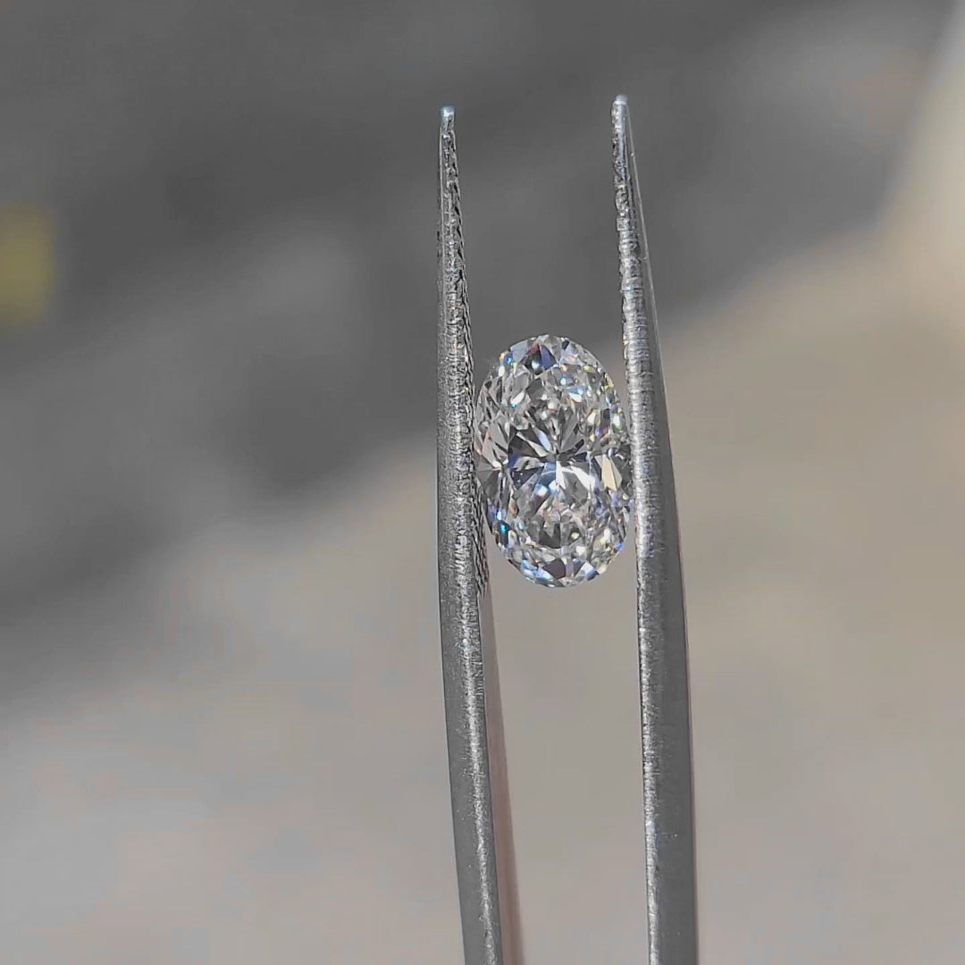 2.05ct oval lab diamond (E/VVS2) in sunlight, showing brilliant sparkle with minimal bow-tie