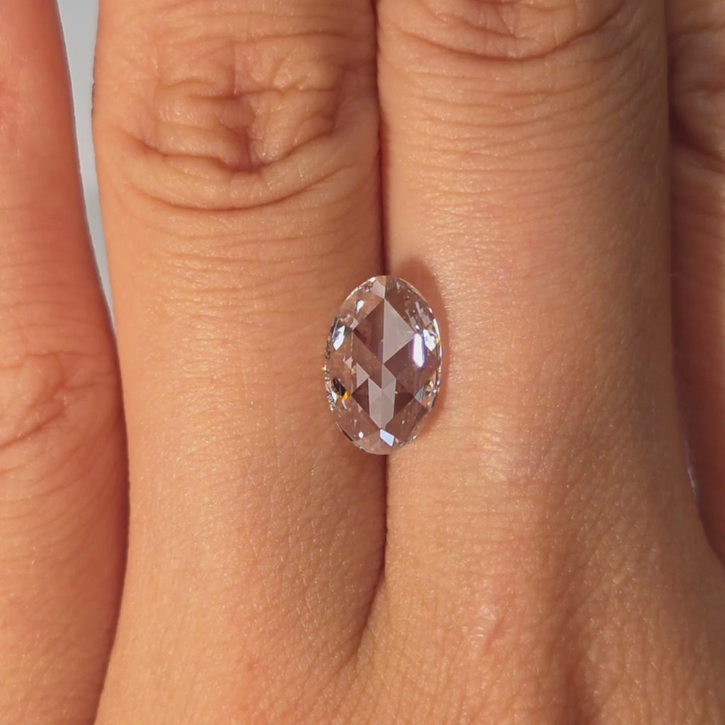 Lab diamond 1.82ct oval rose cut D color VVS1 by DovEggs hand modeled in warm indoor light.