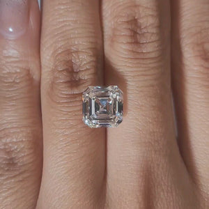 "Hand-modeled video of 4.038ct asscher diamond in warm indoor lighting"