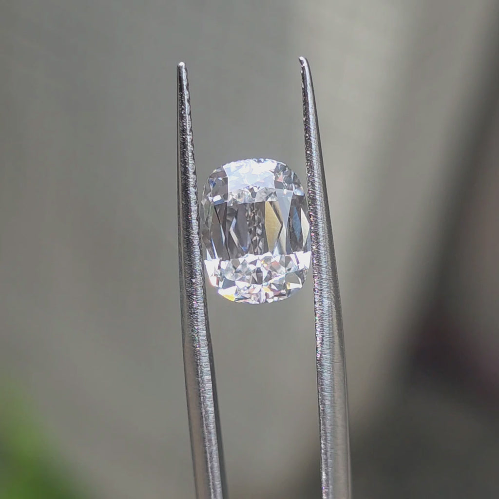 Lab diamond 3.15ct cushion brilliant cut D color VS1 by DovEggs displaying exceptional brilliance in outdoor sunlight.