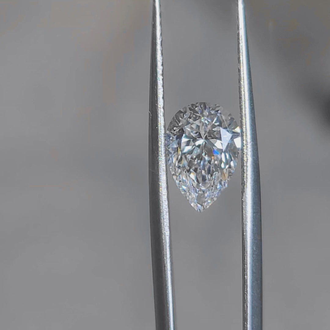 Sunlight video highlighting 2.166ct pear cut's teardrop shape and F color