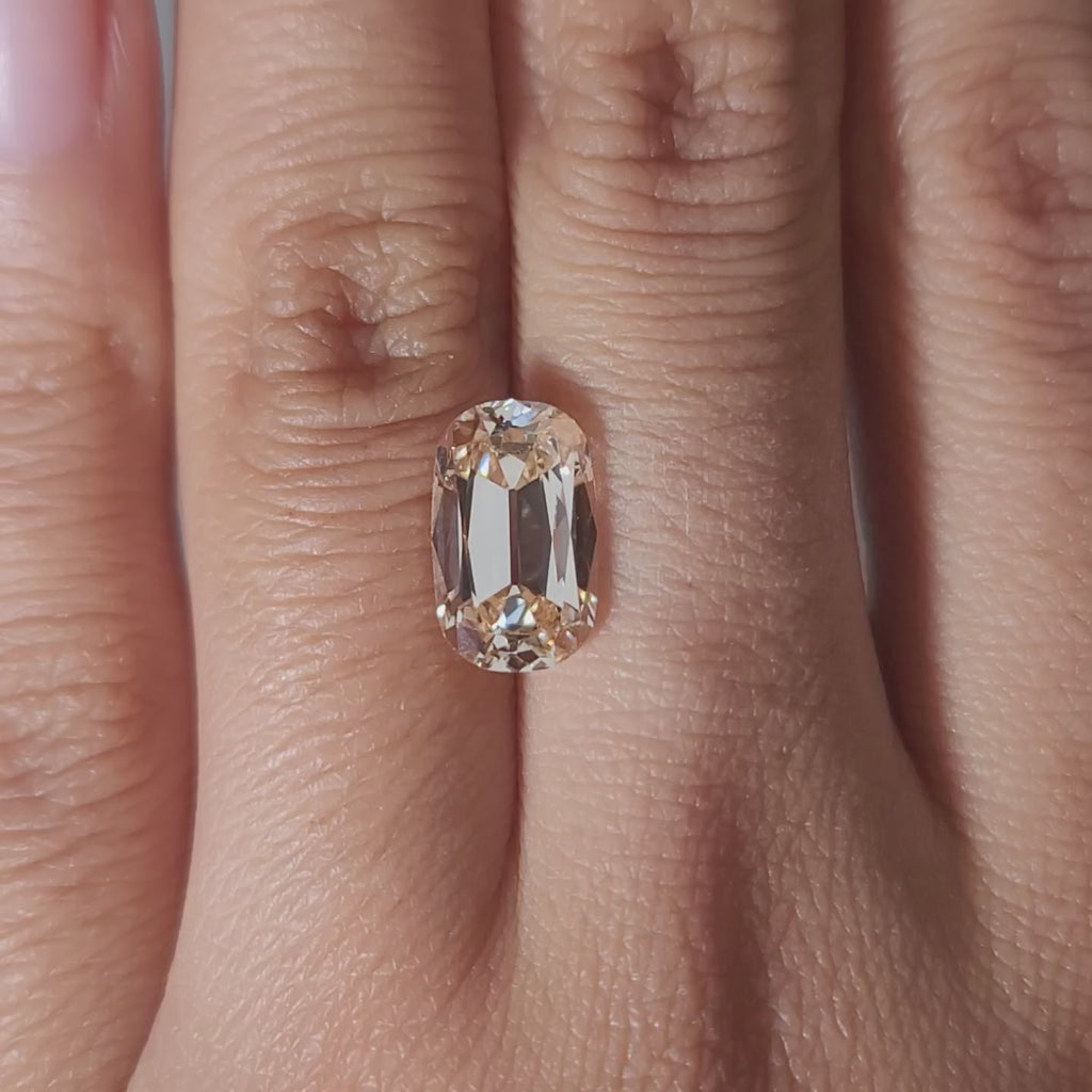 3.26ct Cushion orange diamond in cozy ambient light