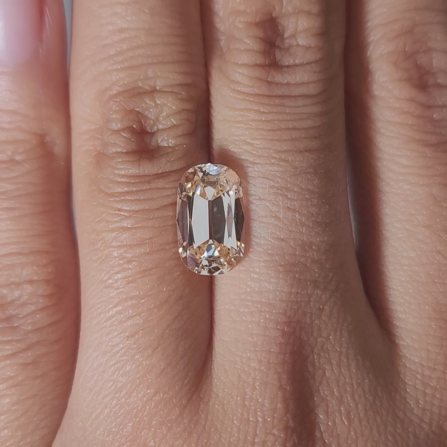 3.26ct Cushion orange diamond in cozy ambient light
