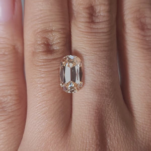 3.26ct Cushion orange diamond in cozy ambient light