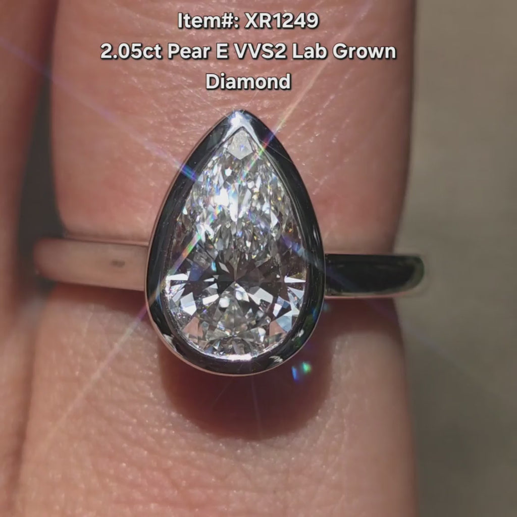 DovEggs Pear lab diamond engagement  ring sparkling in sunlight video