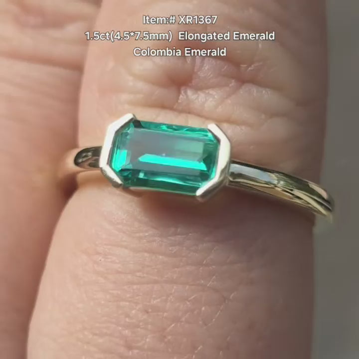 DovEggs Elongated emerald cut Colombia Emerald ring sparkling in sunlight video