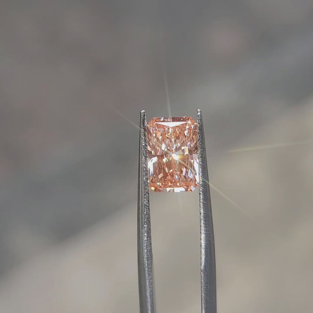 Natural daylight video emphasizing 2.14ct radiant cut's color zoning