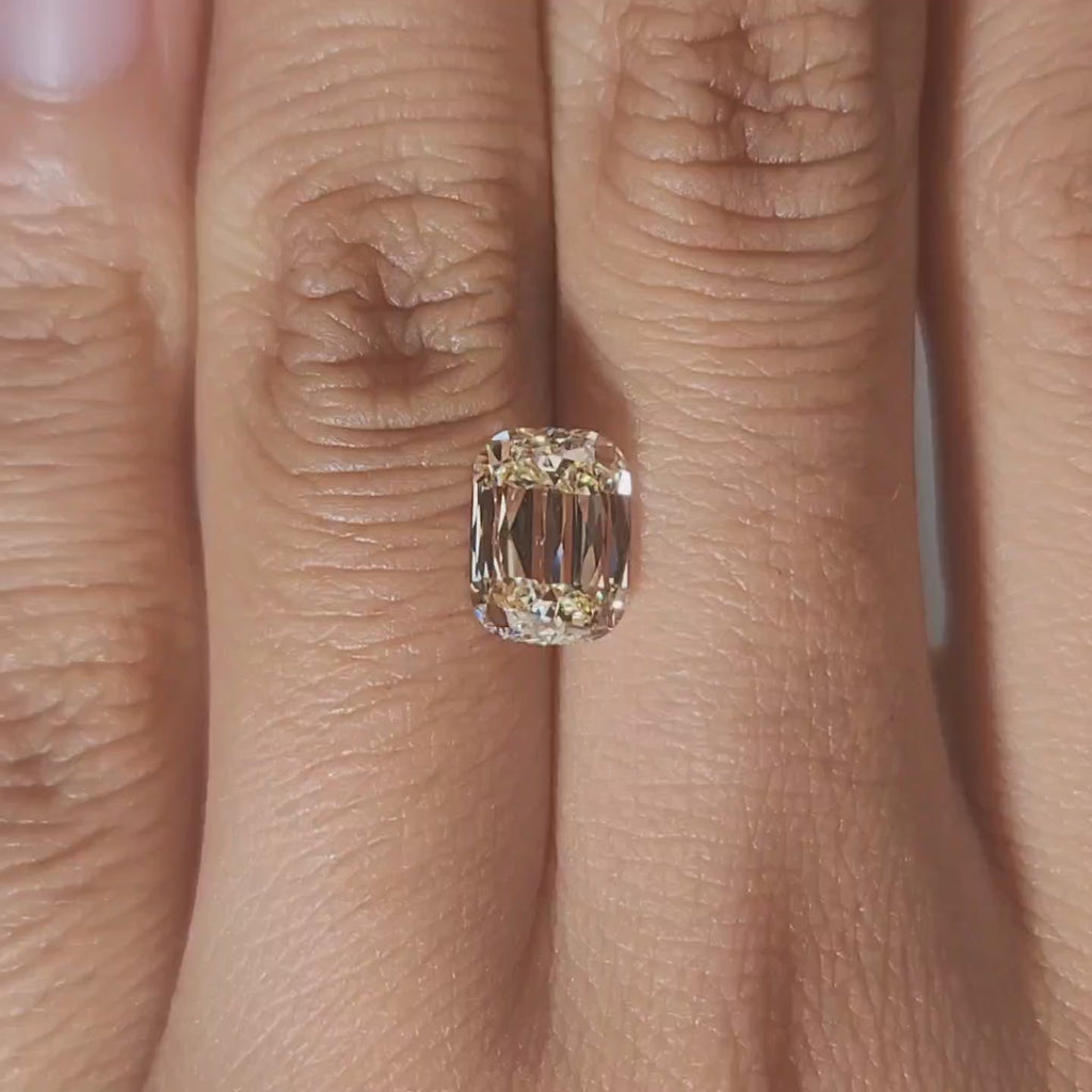 Finger video of 2.092ct elongated cushion cut in indoor lighting