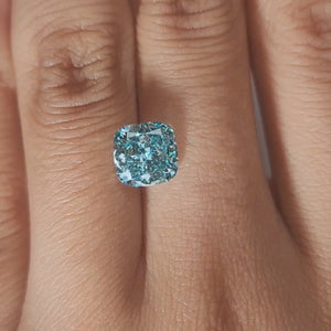 Ring-setting video of 2.362ct blue cushion diamond in soft indoor light