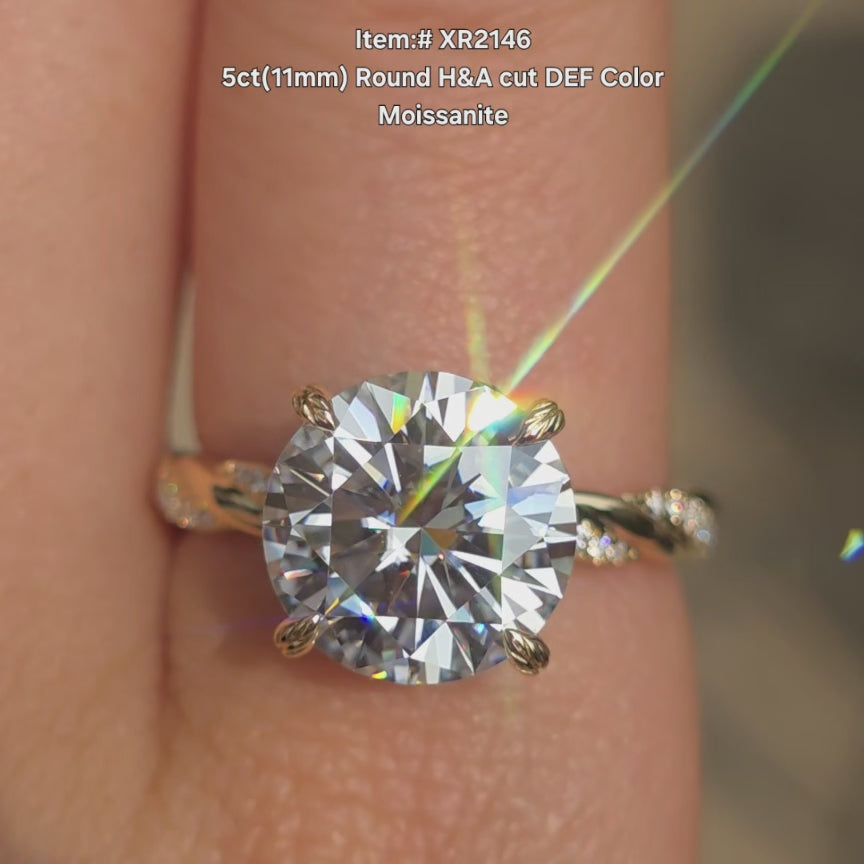 DovEggs round H&A cut DEF color moissanite ring sparkling in sunlight video.