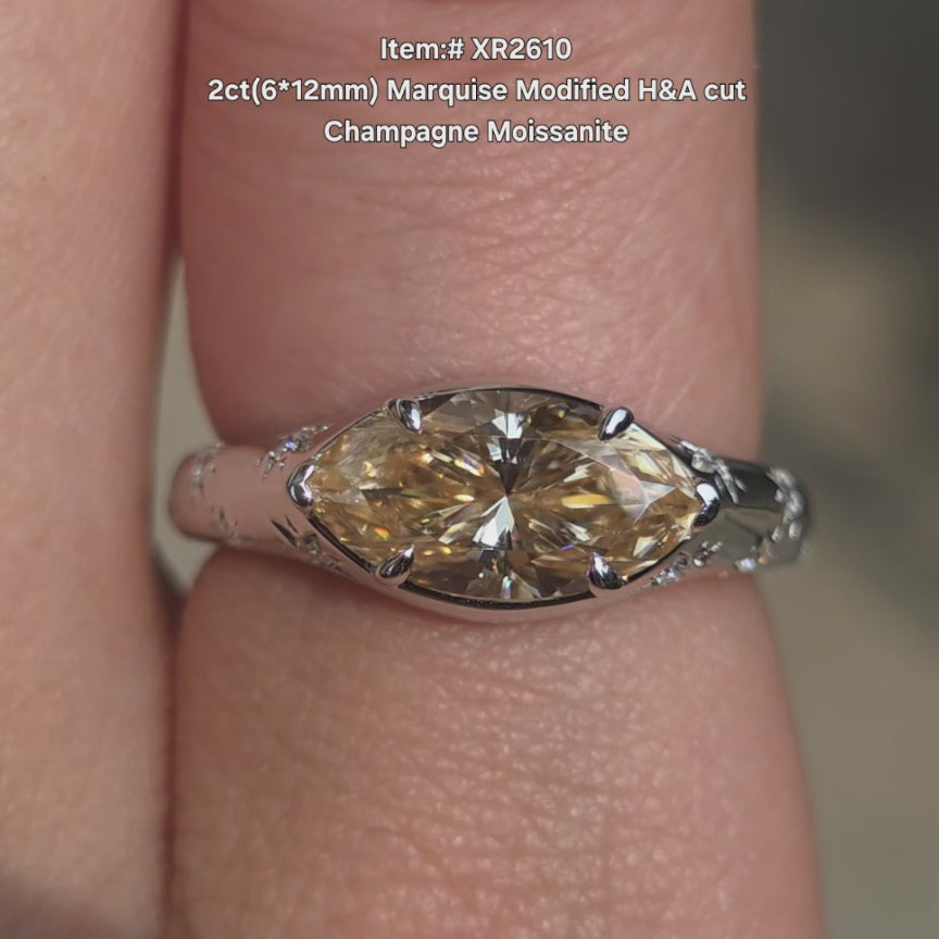DovEggs marquise modified H&A cut champagne color moissanite ring sparkling in sunlight video.