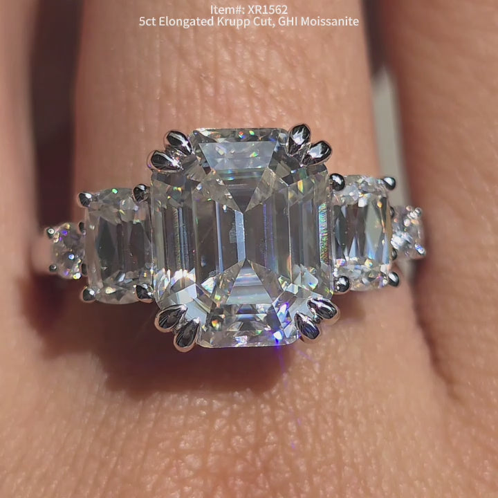 DovEggs 5ct Elongated Krupp cut moissanite ring sparkling in sunlight video.