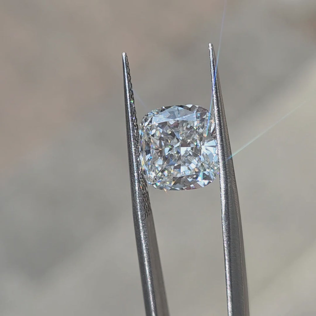 Sunlight showcases the brilliance of a 5.13ct cushion brilliant cut lab diamond.