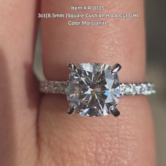 DovEggs Square cushion cut moissanite engagement ring with claw prongs sparkling in sunlight video.