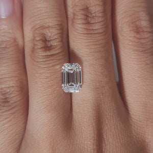 Hand-modeled video of 2.682ct emerald cut diamond in warm indoor lighting