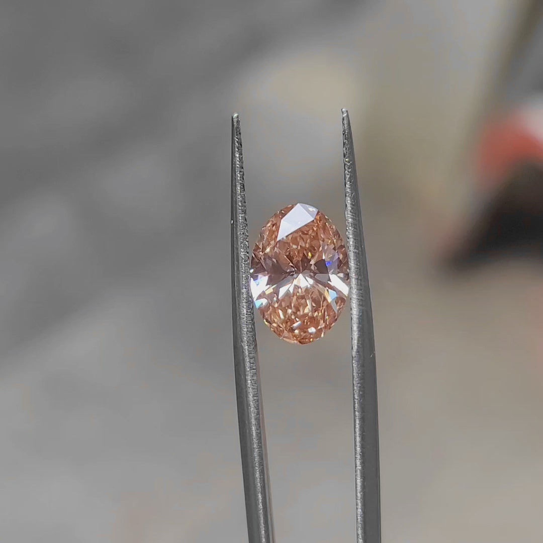 3.07ct Oval lab diamond’s vivid pink sparkle in sunlight