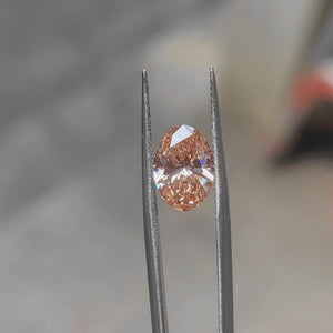 3.07ct Oval lab diamond’s vivid pink sparkle in sunlight