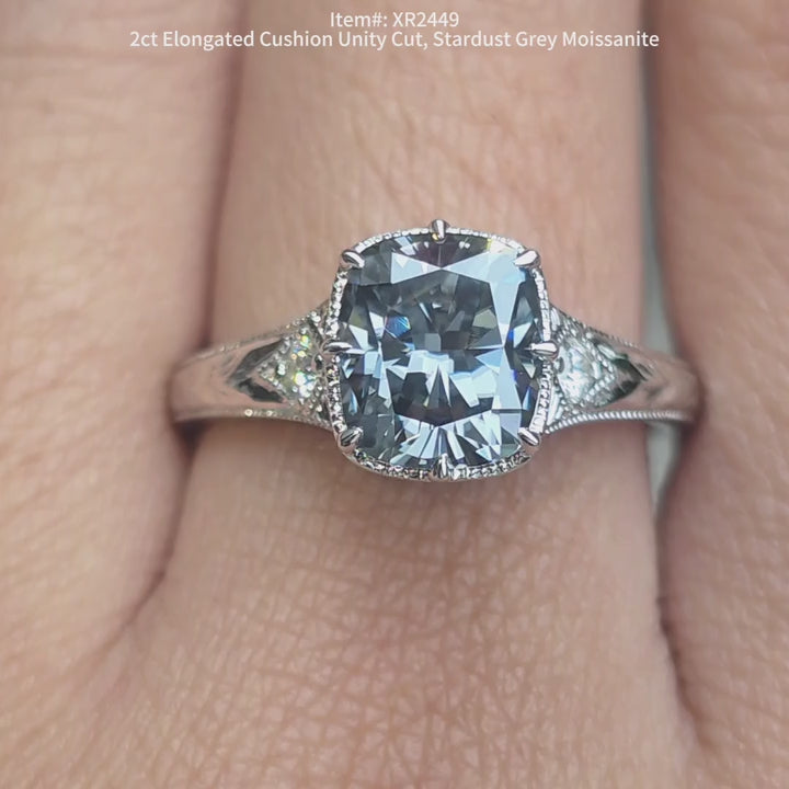 Elongated cushion unity cut stardust grey color moissanite ring sparkling in sunlight video