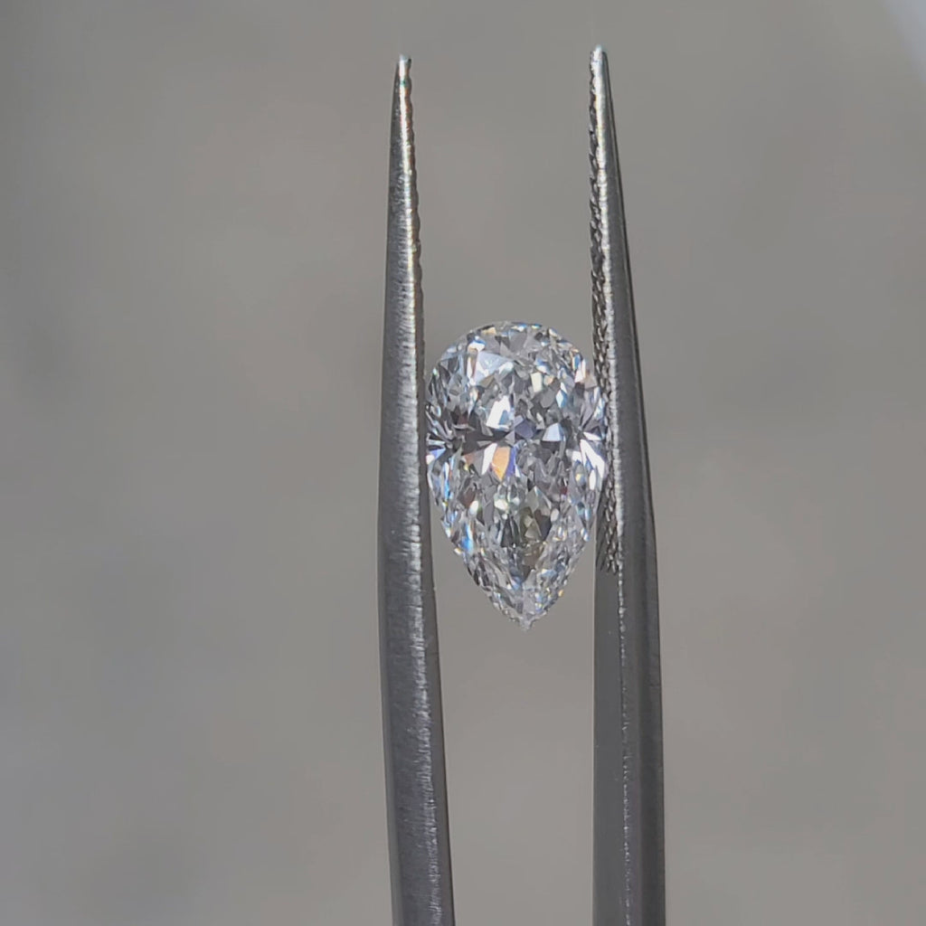 "Sunlight video showing 2.398ct pear cut diamond's D color sparkle"
