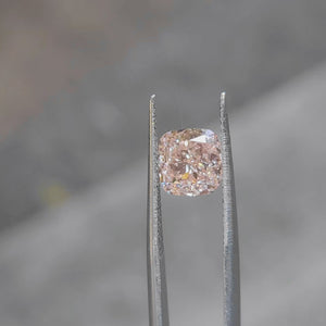 Romantic lighting video of 2.530ct cushion cut's pink hue lab diamond
