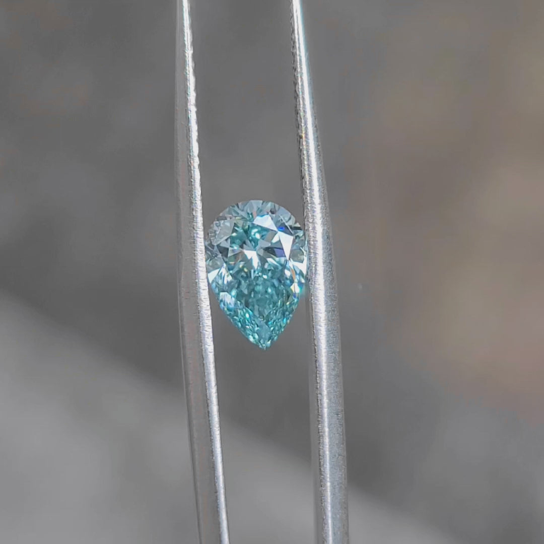 Outdoor video capturing 1.620ct pear cut's teardrop shape and blue radiance