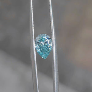 Outdoor video capturing 1.620ct pear cut's teardrop shape and blue radiance