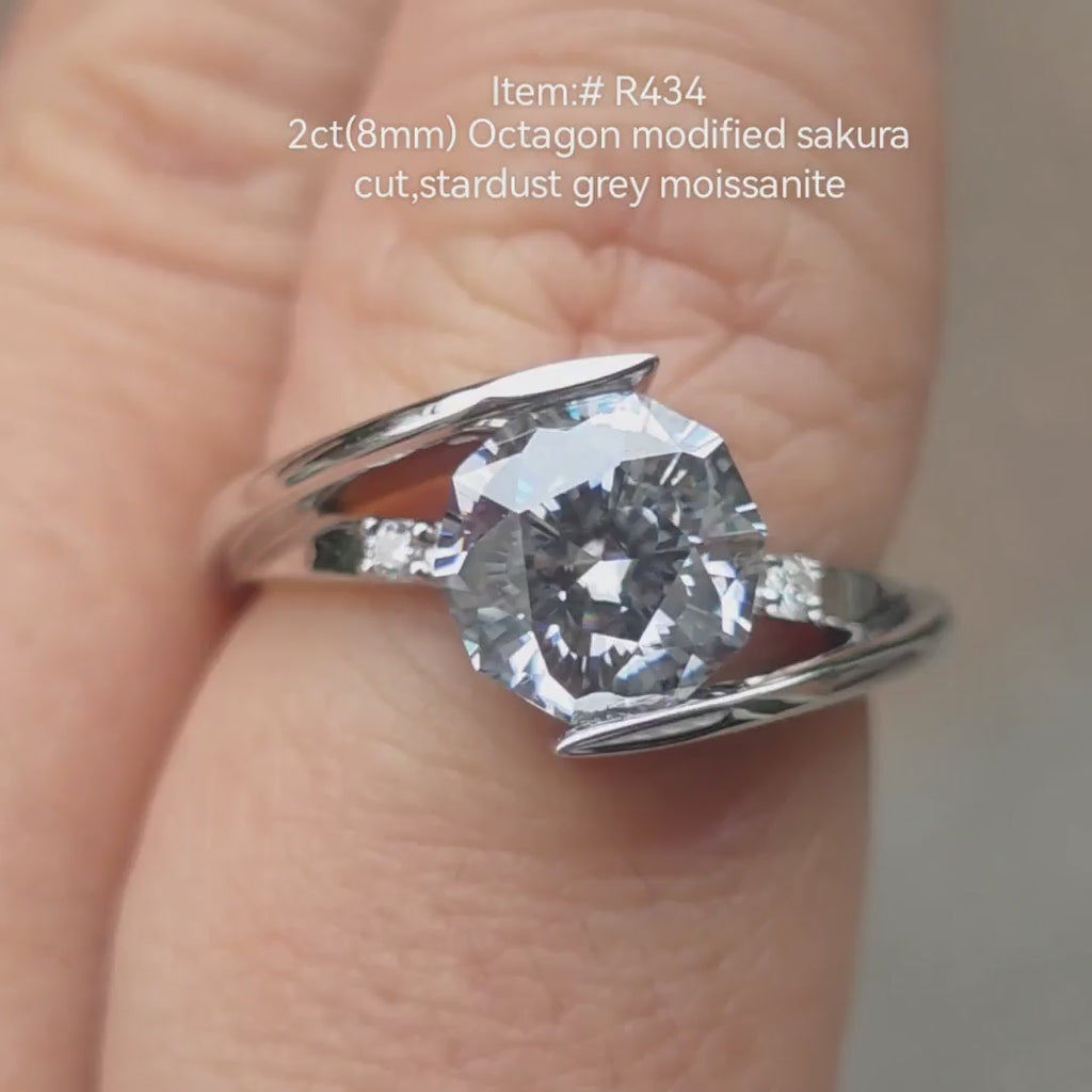 2ct Octagon Modified Sakura Cut Stardust Grey moissanite engagement ring shown on hand in natural light, white gold tension setting 