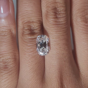 3.367ct Cushion E color VVS1 diamond glowing in warm handheld lighting