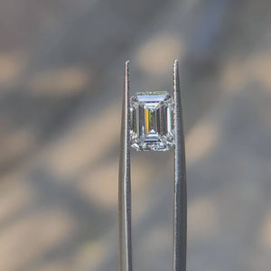 2.26ct emerald cut D color diamond video showing mirror-like facets in sunlight