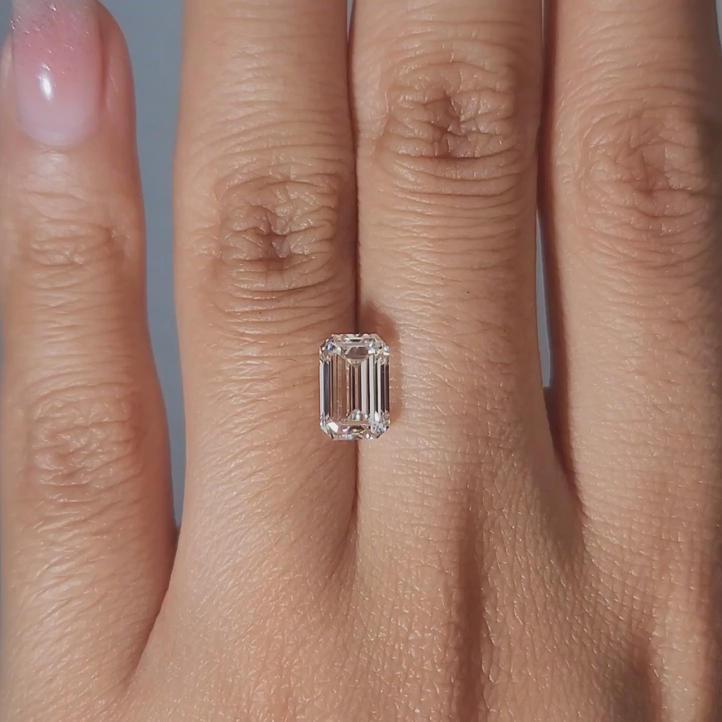Close-up slow motion of emerald step cuts in lab diamond