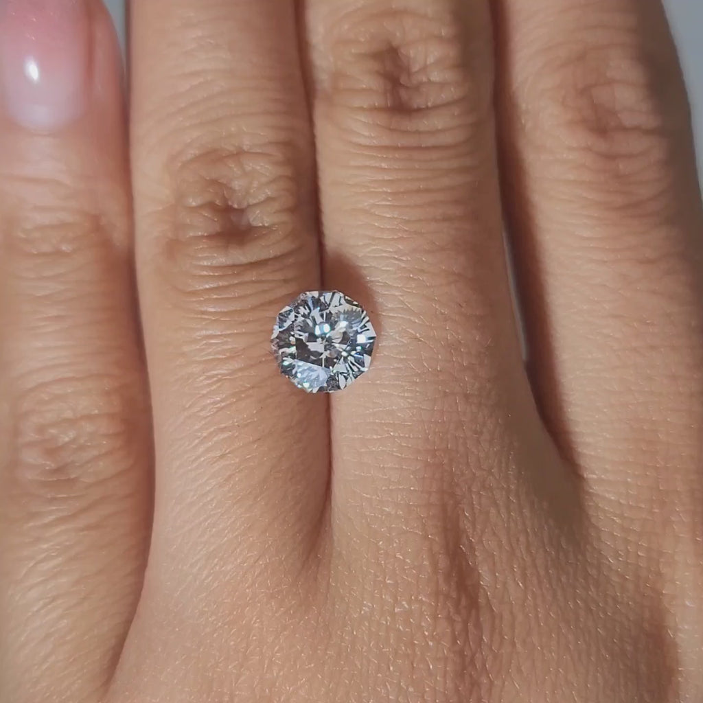 New lab diamond cut demonstration on hand under warm light