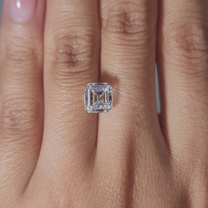 Close-up video of 3.01ct Asscher diamond's concentric facets in warm light
