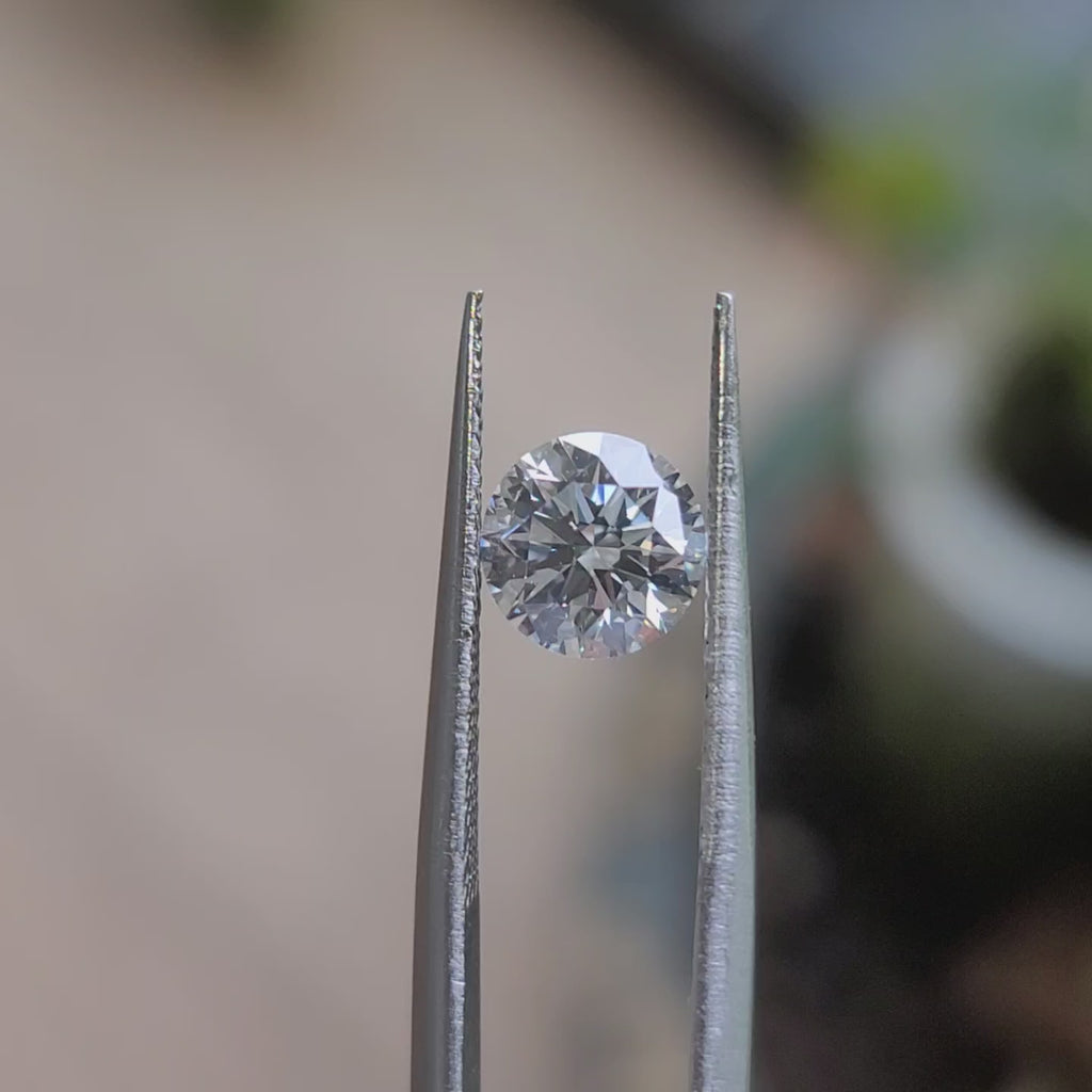 1.5ct round brilliant lab diamond (D color, VS1 clarity) sparkling in natural sunlight, showcasing excellent cut precision