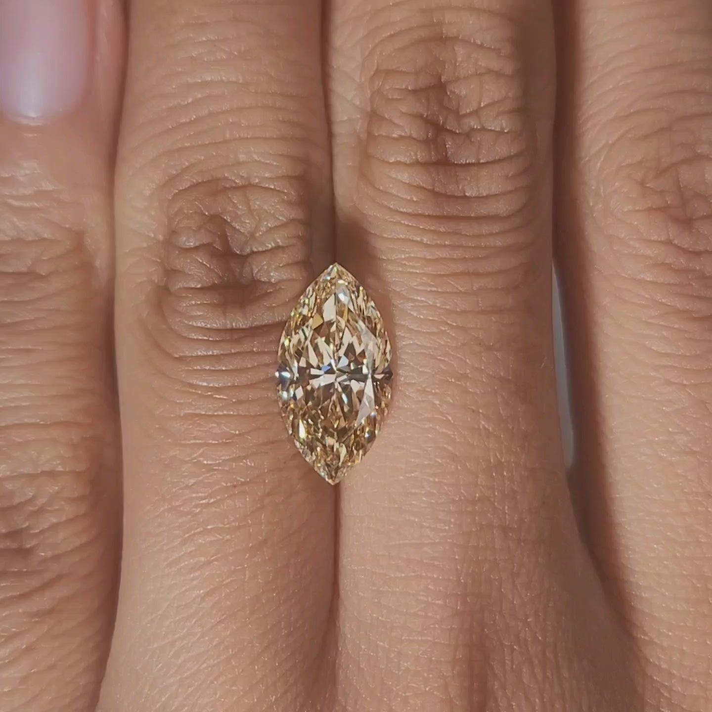 Close-up video of 3.260ct marquise cut's elongated silhouette on hand