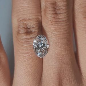 Hand-modeled video of 2.54ct oval diamond in warm interior lighting