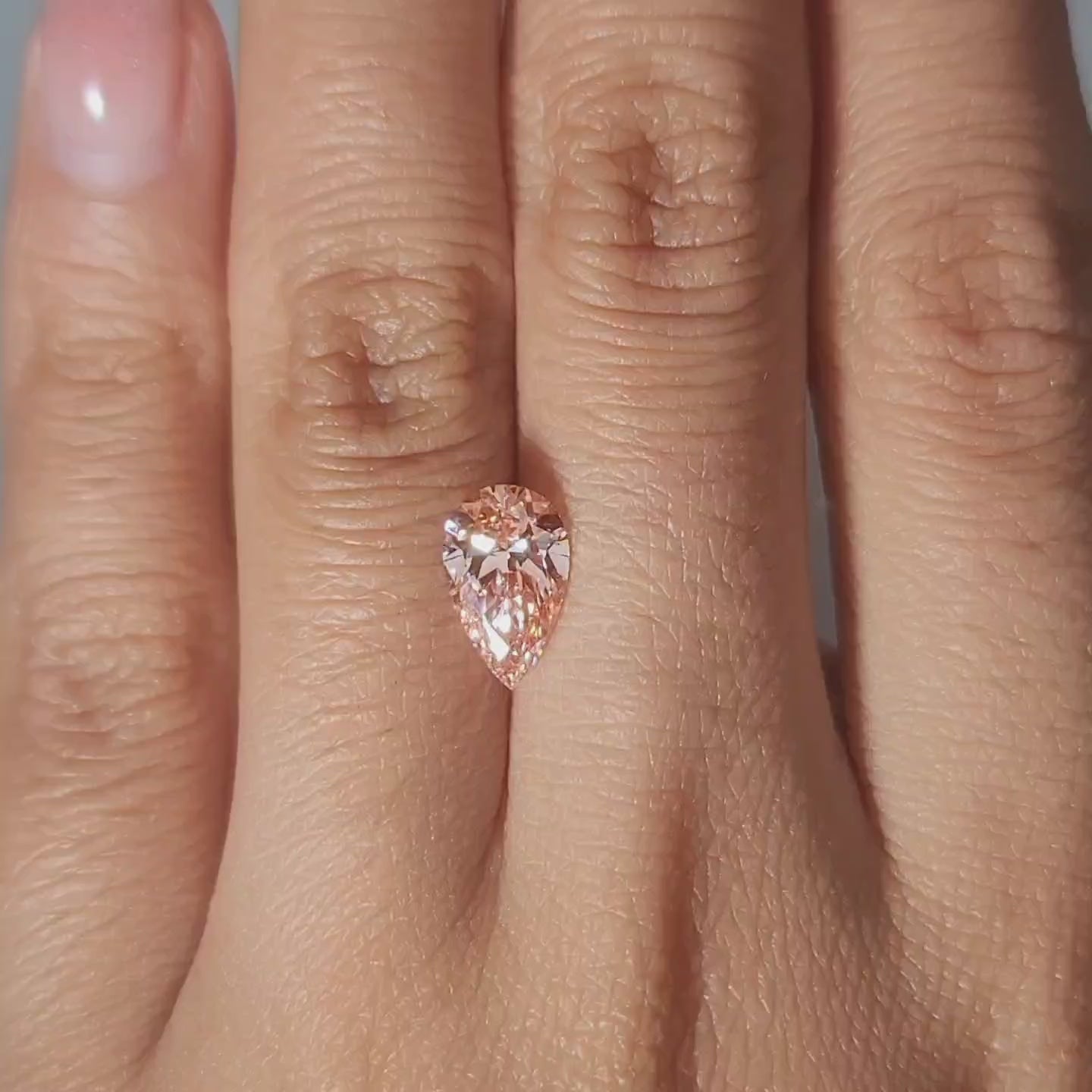 Warm indoor lighting video of 1.54ct pear lab diamond