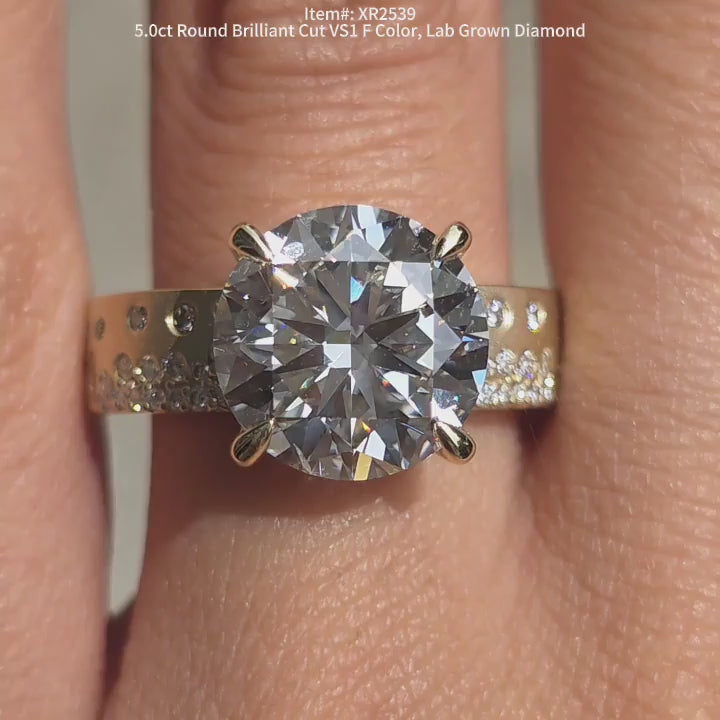 DovEggs Round lab diamond engagement ring sparkling in sunlight video