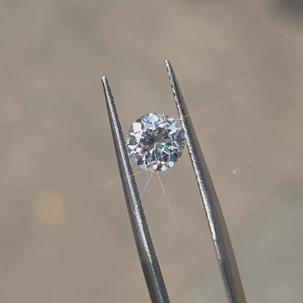 A 1.08ct Crown Arrow Cut™ lab diamond sparkles in outdoor sunlight.