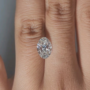 Finger-modeled video of 2.03ct oval diamond in ambient indoor light