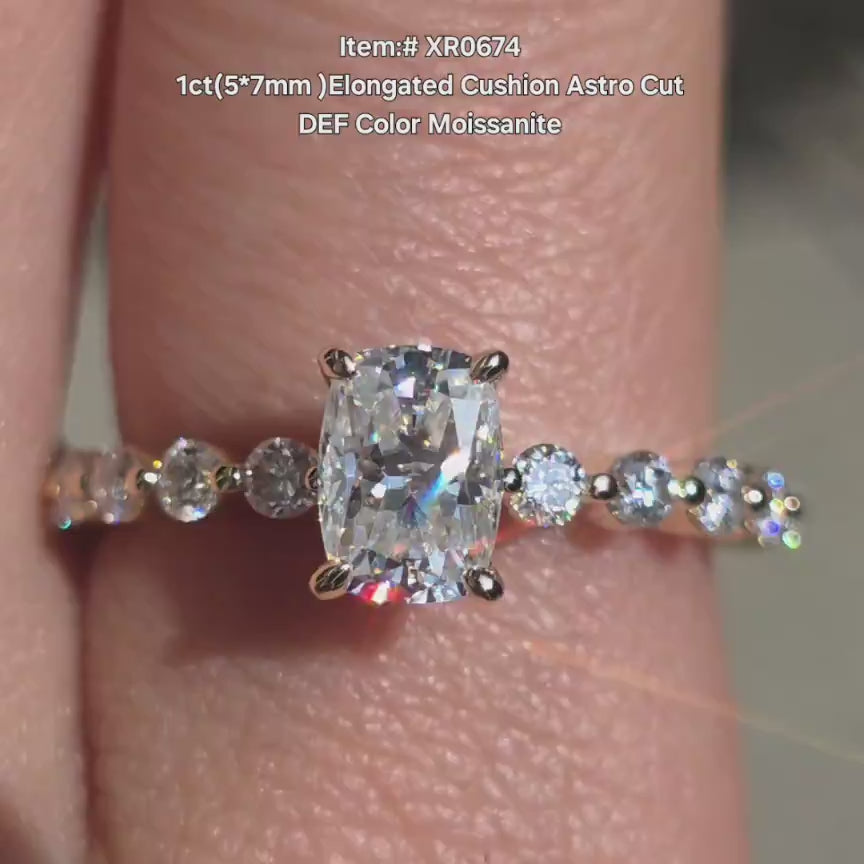 DovEggs elongated cushion moissanite with side stones engagement ring in sunlight